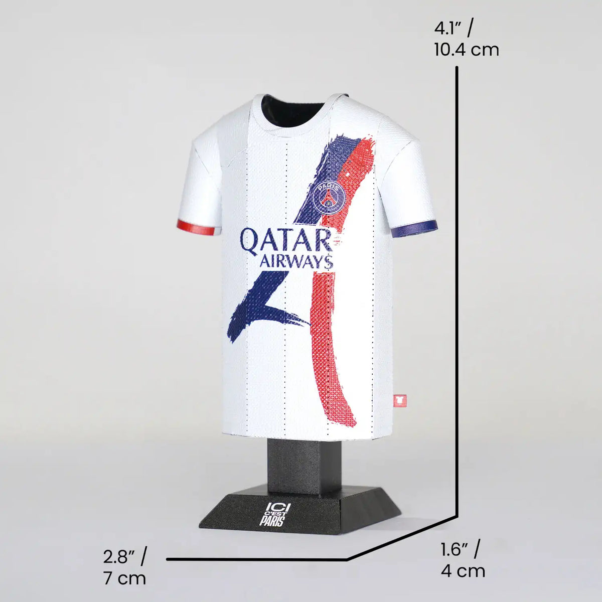 Miniature sports jersey with Qatar Airways logo on a mannequin bust, displayed against a light gray background.