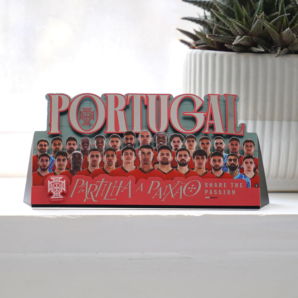 A front-facing view of a collectible Portugal 2024 stadium diorama model featuring a realistic miniature pitch, grandstand elements, and red branding decals