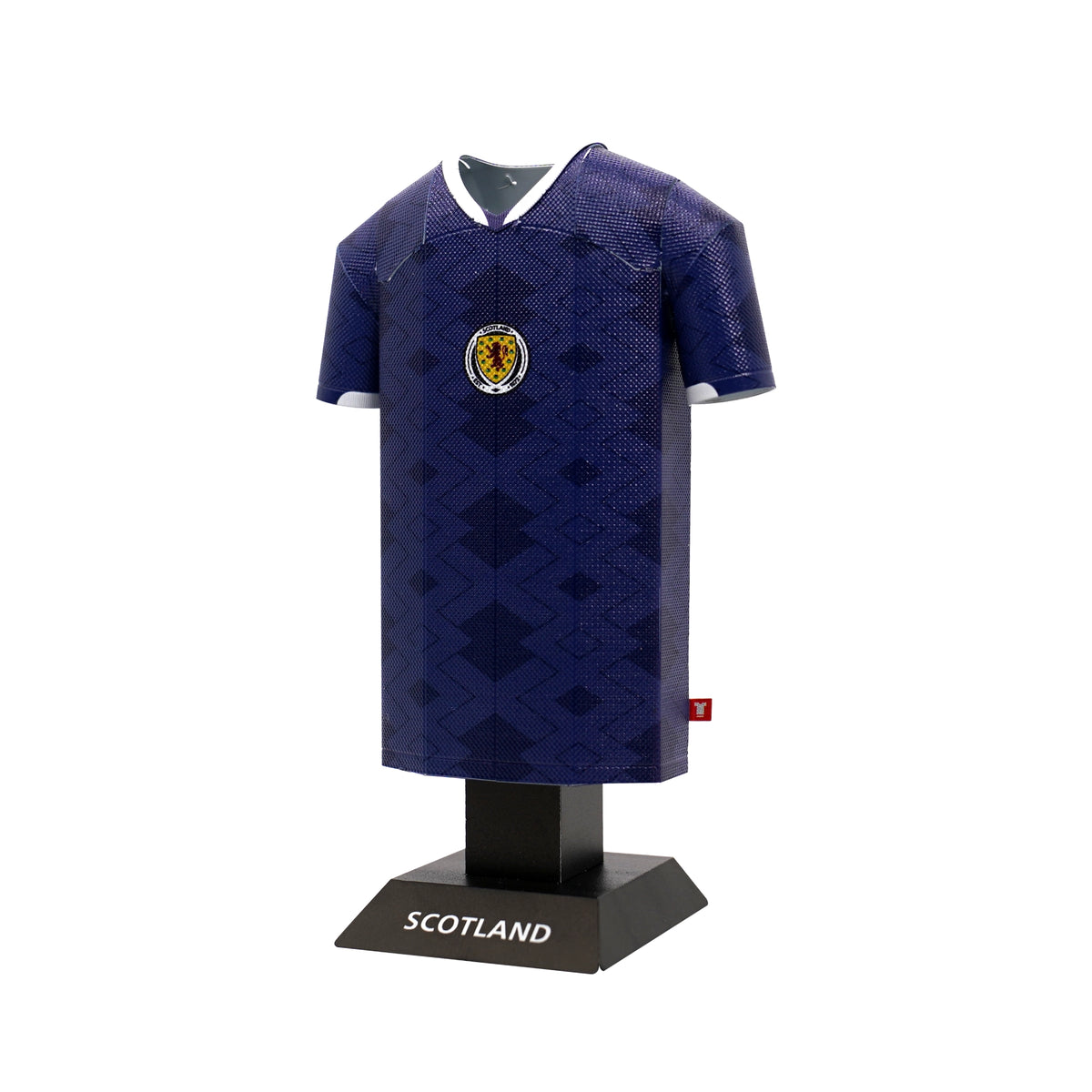 Blue sports jersey with a crest on a black stand labeled 'Scotland' against a white background