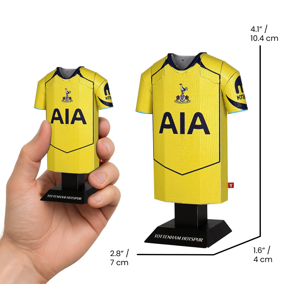 Model of a Tottenham Hotspur football jersey held by a hand with measurements displayed.