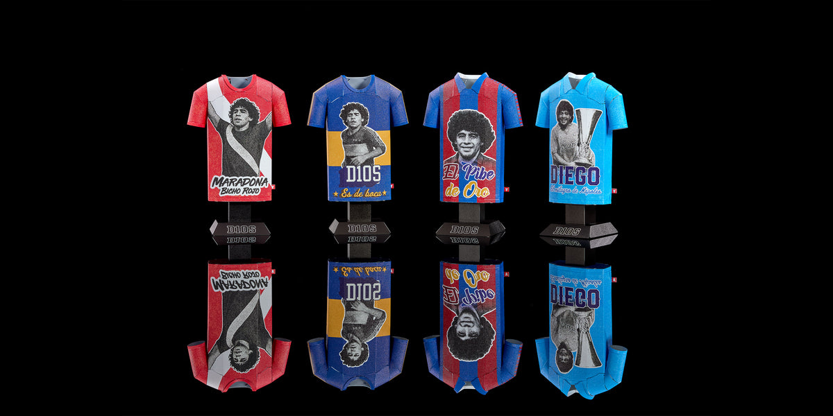 Set of six colorful t-shirts with graphic designs on a black background