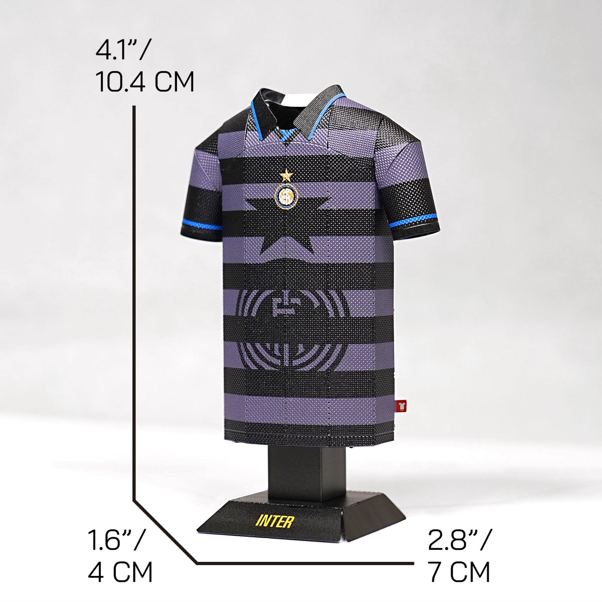 A product graphic showing a retro Inter Milan third jersey collectible on a stand, complete with measurement lines indicating its physical dimensions.