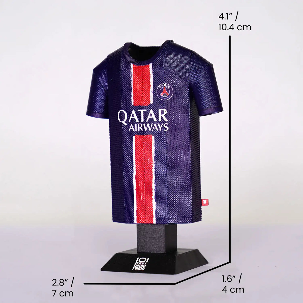 Miniature soccer jersey on a stand with dimensions indicated