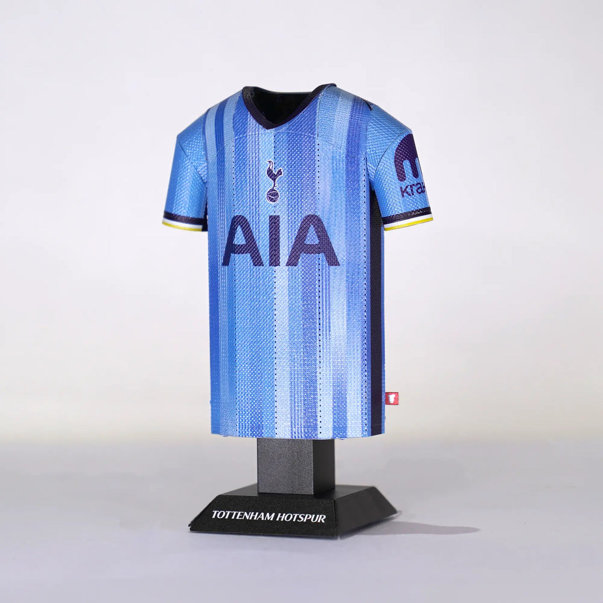 Blue Tottenham Hotspur football jersey on a mannequin against a white background